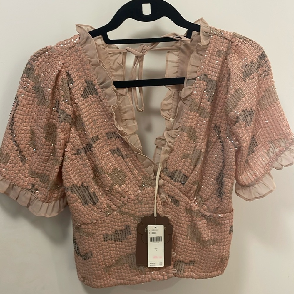 Light pink sequin top from Anthropologie! Never worn and tags on! Size small